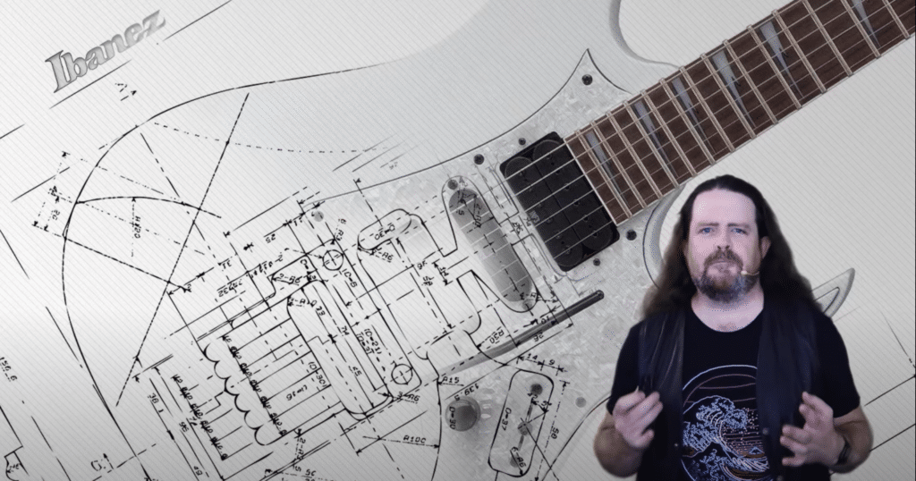 Dylan Beattie in front of a guitar schematic drawing
